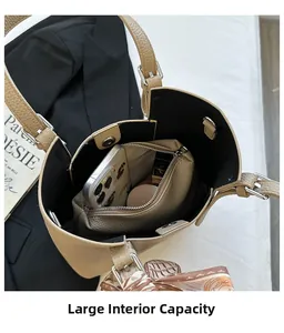 Khaki pebbled leather tote with inner pouch, floral ribbon and spacious interior