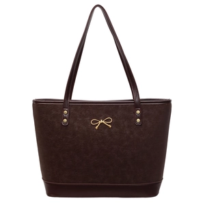 Retro coffee brown faux leather tote bag with golden bow hardware for daily commuting