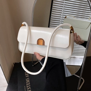 Minimalist white patent leather baguette bag with vintage gold metal buckle detail