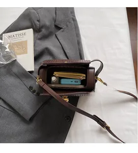 Interior view of the vintage brown barrel bag showing spacious storage for daily essentials