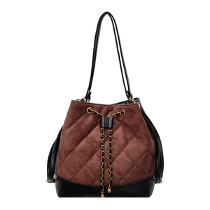 Quilted drawstring bucket bag in brown suede and black leather with gold chain details