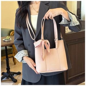 Pink lychee leather tote with printed silk scarf detail and adjustable shoulder strap