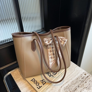 Classic tan faux leather tote bag with houndstooth ribbon scarf and dark brown handles