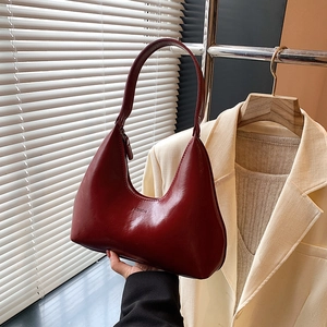 Deep red patent leather hobo shoulder bag with crescent shape for women's daily commute