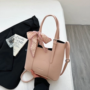 Pink lychee grain leather tote bag with decorative silk scarf and adjustable strap