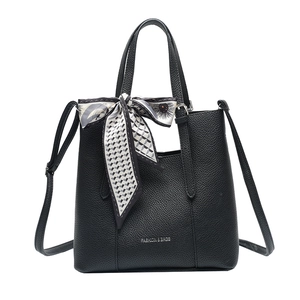 Black lychee textured tote bag with decorative silk scarf and adjustable strap