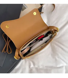 Top view of caramel matte leather bag showing spacious interior with multiple pockets