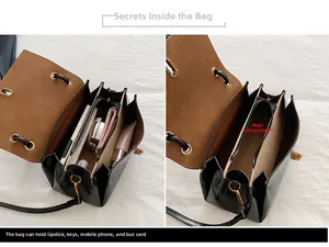 Internal view of minimalist black crossbody bag showing three-layer organizer compartments