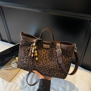 Large leopard print tote bag with brown leather handles and golden lock for women