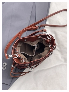 Detailed interior of leopard print bucket bag featuring lining and zipper pocket