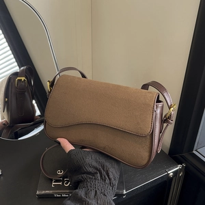 Deep brown matte suede underarm bag with minimalist vintage stitching and gold buckle detail