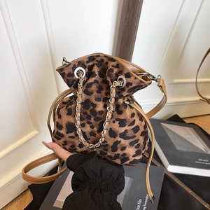 Leopard print drawstring bucket bag with silver chain and thin shoulder strap
