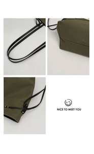 Close-up of military green canvas tote bag featuring metal rivets and fine stitching detail