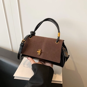 Brown and black bicolor tote bag with golden metal twist lock and adjustable shoulder strap