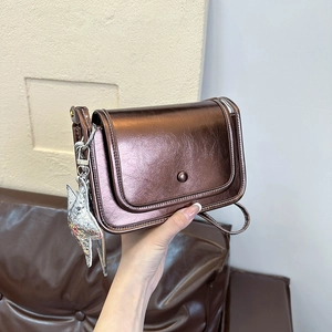 Minimalist metallic bronze crossbody square bag with vintage texture and star charm