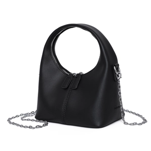 Minimalist black crescent soft leather handbag with circular handle and silver chain strap