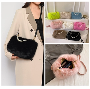 Detail view of plush crossbody bag with pearl handle and multiple color options