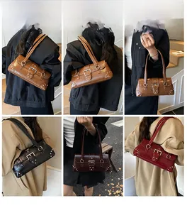Detailed views of vintage croc-effect baguette bags with metallic buckle and stud accents