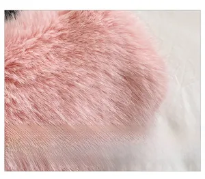 Close-up of soft pink faux fur texture showing premium long-fiber plush material