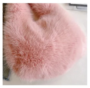 Close-up of thick pink faux fox fur texture and soft plush fibers on this commute bag