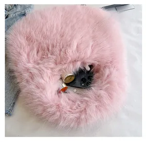 Detailed view of the spacious pink plush faux fur handbag interior with soft texture