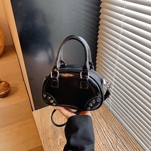 Retro black bowling handbag with colorful studs and polished PU leather finish