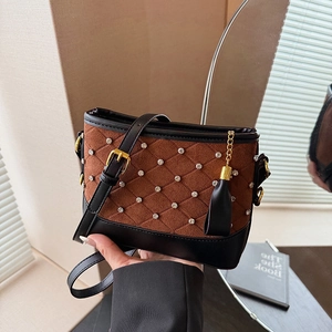Brown quilted crossbody bag with rhinestones and black fringe, elegant style for women