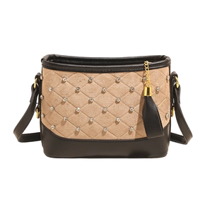 Beige quilted hobo bag with rhinestones, black leather straps and golden hardware
