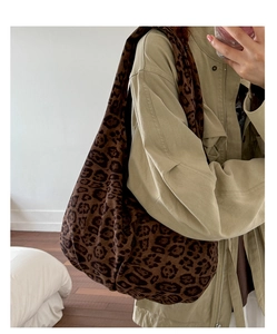 Detail of leopard print tote bag showing large capacity and soft canvas material texture