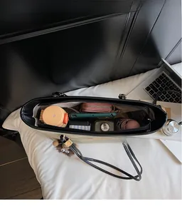 Top view of large beige tote bag interior showing spacious storage for daily essentials