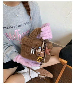 Detail of a brown teddy plush square mini bag featuring cute bear charms and textures