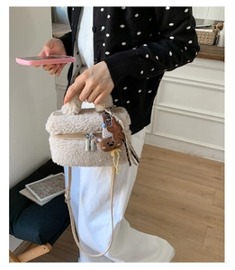 Furry cream-colored mini square bag with cute bear charm and leather strap detail