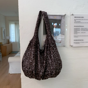 Large leopard print canvas hobo bag for women with wide strap and retro slouchy design