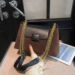 Retro plaid crossbody bag with brown suede and black leather flap featuring gold chain