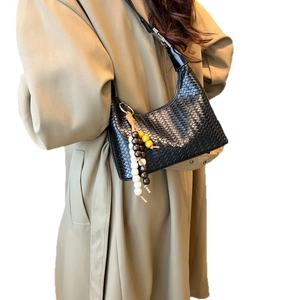 Women's black woven leather hobo shoulder bag with colorful wooden bead tassel charm