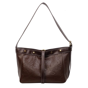 Vintage brown shoulder bag with shiny pleated leather and gold studs on a white background