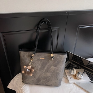 Gray marble texture large tote bag with gold metal trim and brown plush charm