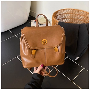 Vintage brauner Lederrucksack mit goldener Schließe und minimalistischem Griff