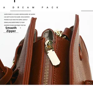 Vue macro détaillée de la fermeture éclair dorée lisse et du cuir grainé de ce sac à main