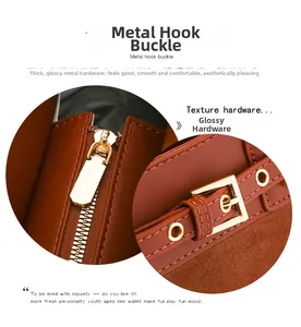 Close-up of golden zipper and adjustable metal buckle on brown lychee leather bag