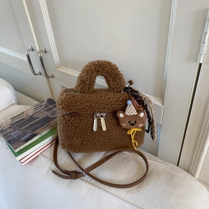 Brown faux shearling mini crossbody bag with cute teddy bear charm and dual zipper closure