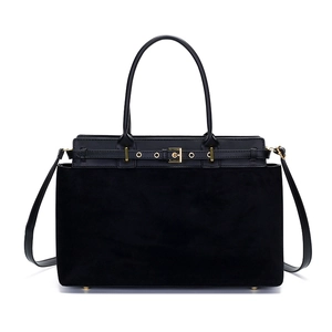 Minimalist black tote bag in mixed leather finish with gold hardware and shoulder strap