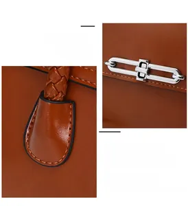 Detail of woven handle and silver metal turn-lock on a brown vintage leather handbag