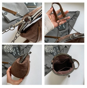 Detail view of brown quilted suede shell bag showing metal clasp and chain strap