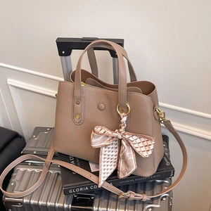 Taupe pebbled leather tote bag with silk scarf on handle and detachable strap