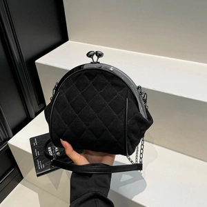 Chic black quilted crossbody shell bag with vintage metal ball clasp and chain strap