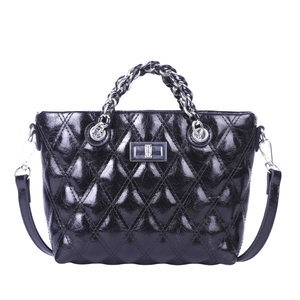 Quilted black crossbody bag with silver twist lock and chain handle on white background