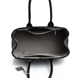 Top view of black tote bag interior with striped lining and zipper pocket detail
