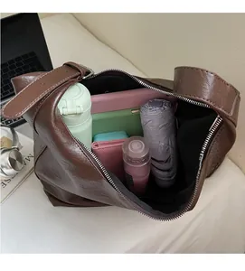 Internal view of dark brown retro leather tote bag showing large capacity for essentials