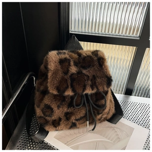 Close-up of leopard print faux fur backpack texture with drawstring and metal tips